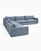 Blue-gray sectional sofa with L-shaped configuration, multiple cushions, and clean lines.