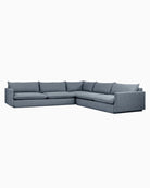 Gray L-shaped sectional sofa with six pillows and straight legs.