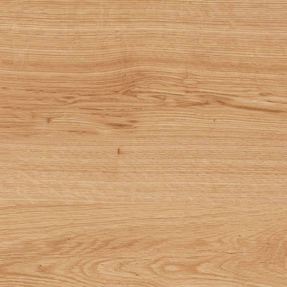 Light tan wood surface with visible grain patterns and natural knots.